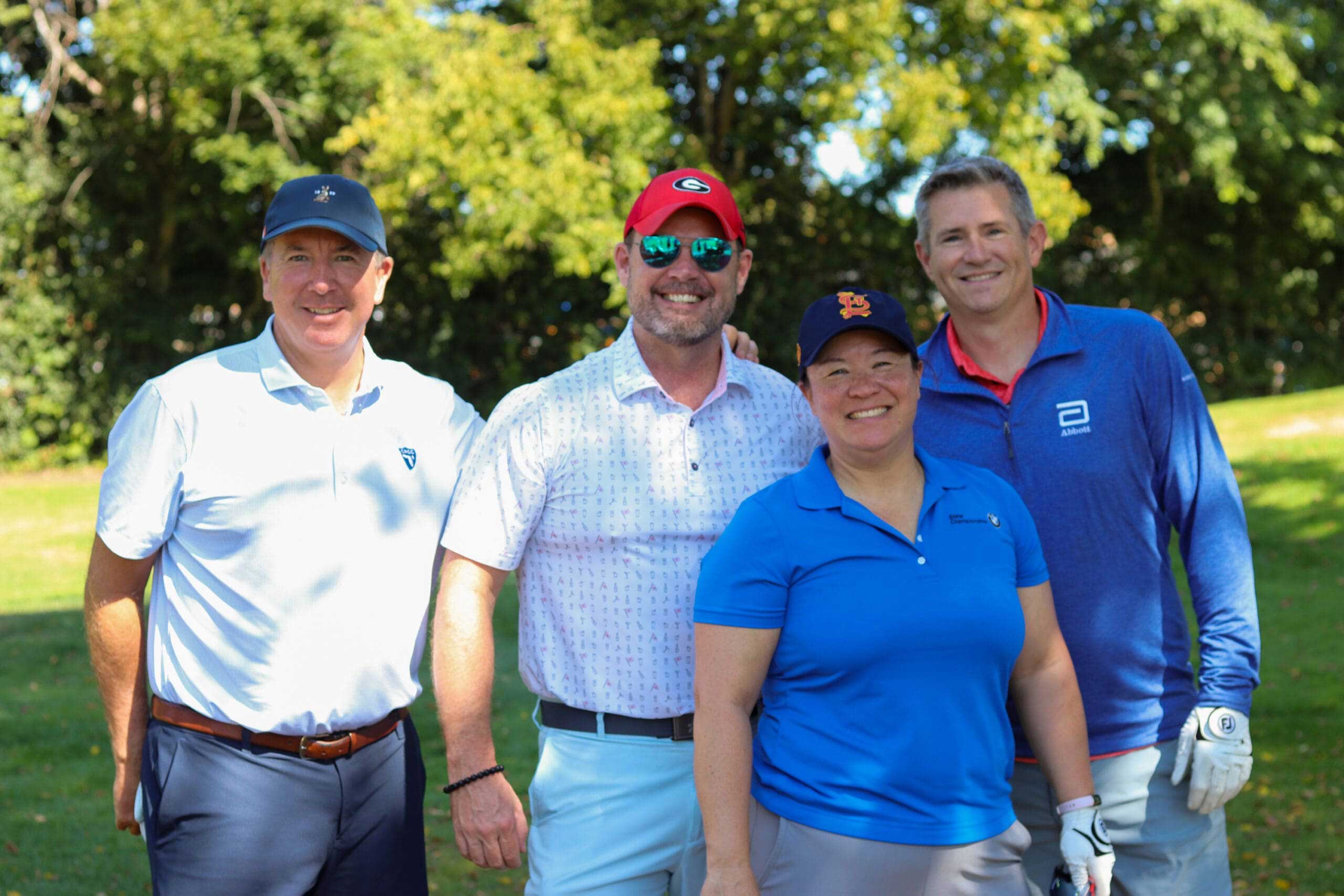 A group of golfer's smiling at One Hope United's Charity Golf Outing.